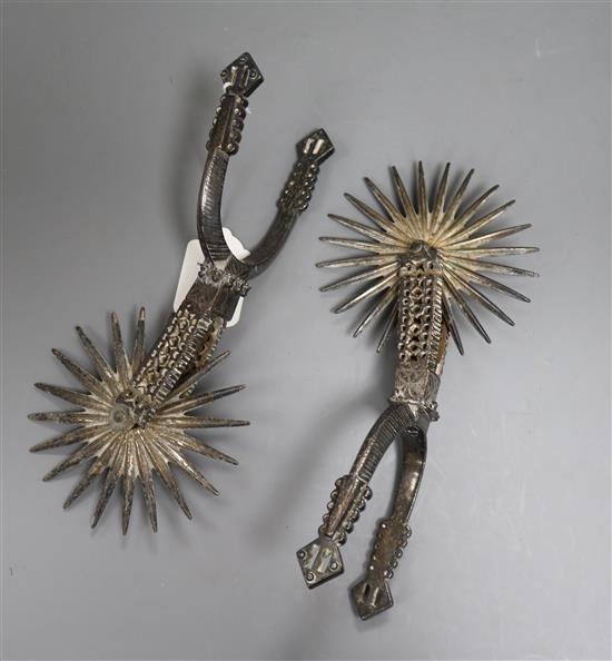 A pair of 19th century Spanish 24-rowel plated spurs